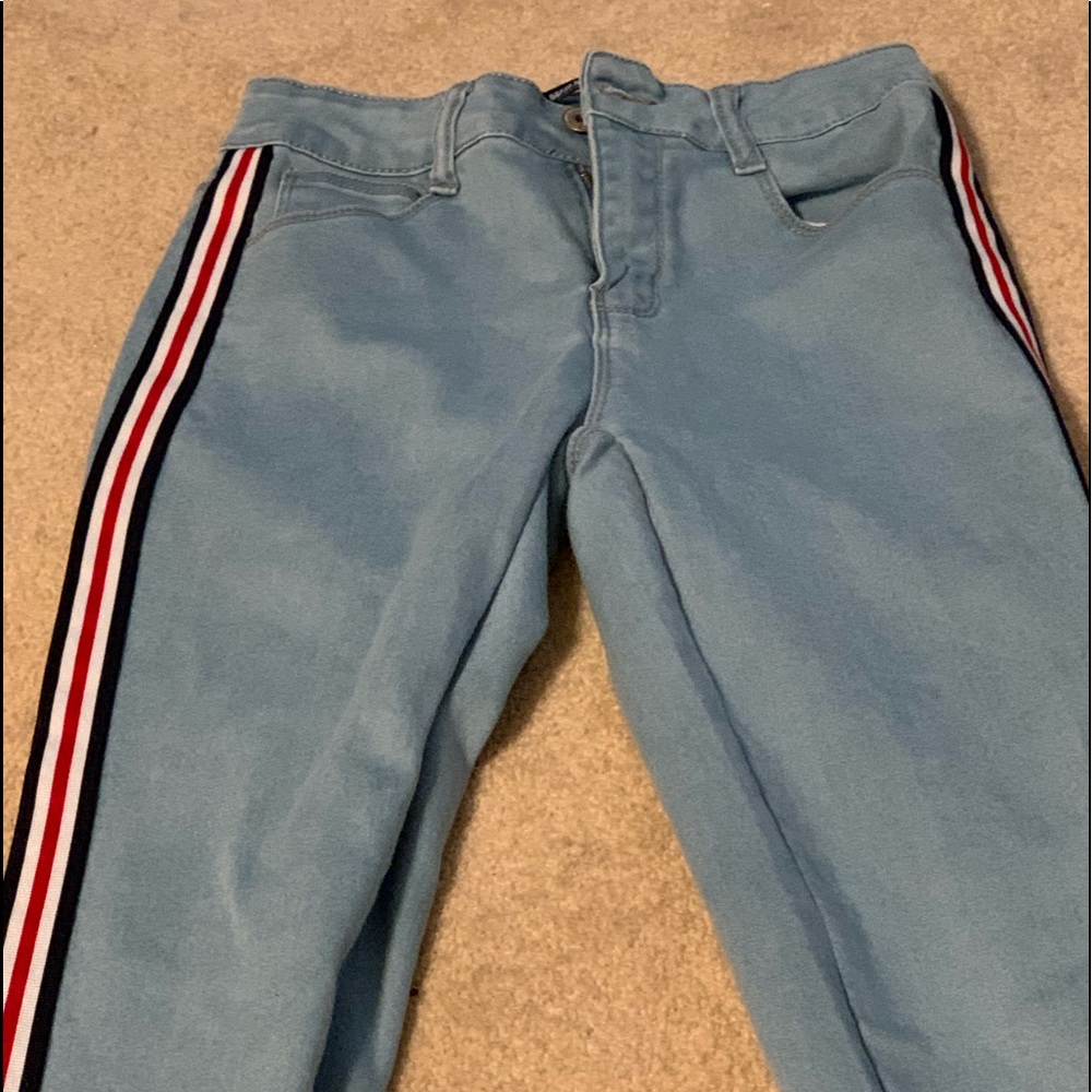 light wash jeans with stripes on the side